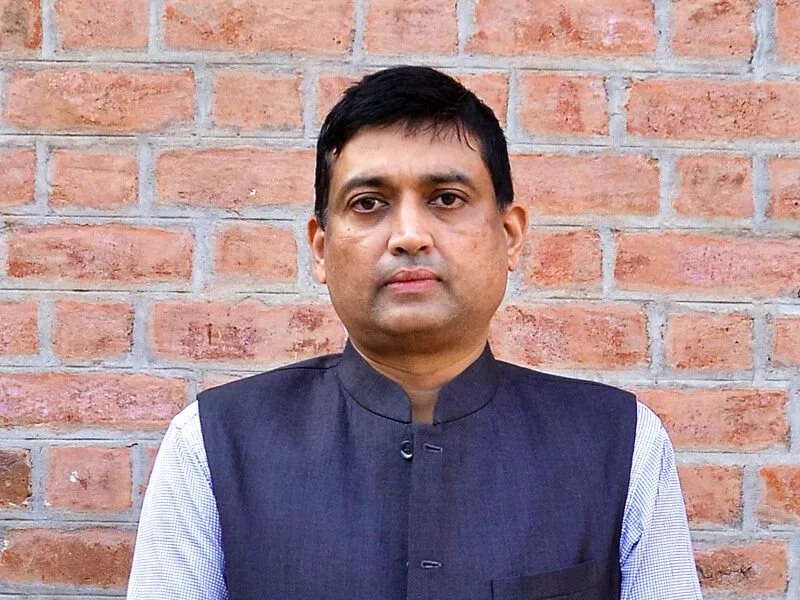 Portrait of Satya Acharya against a brick wall