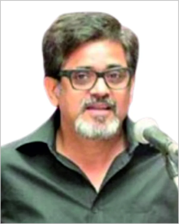 Portrait of a man with a beard in a dark shirt
