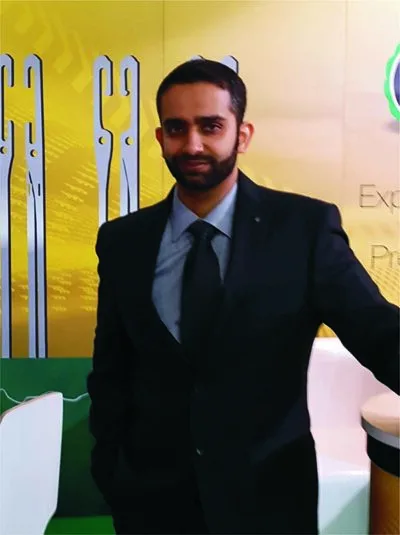 Man in a dark suit and tie at an event