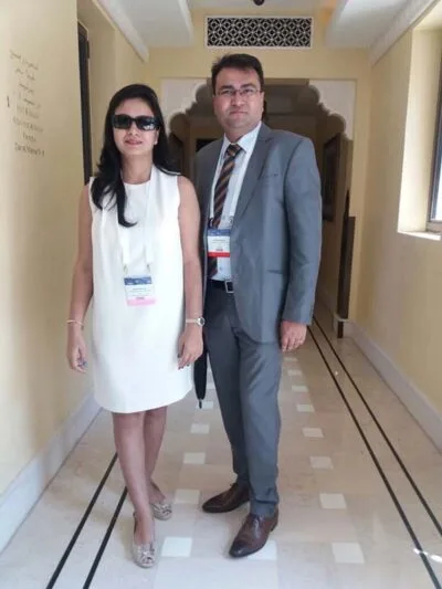 A woman and a man standing together in a corridor