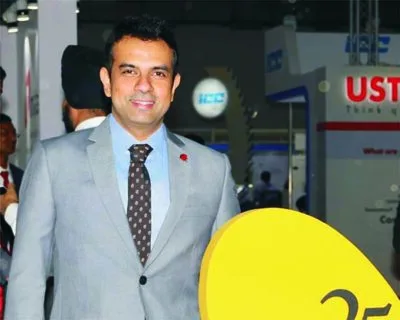 Man in a grey suit at an event