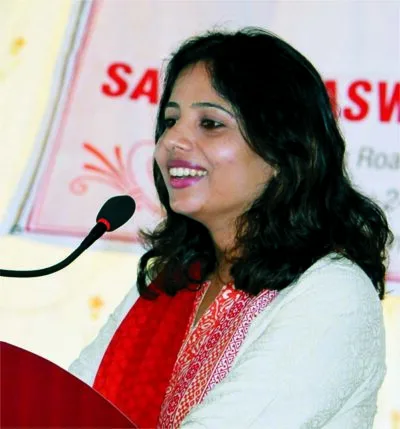 Woman speaking at a podium during an event