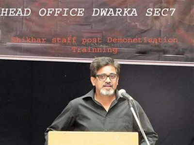 Man speaking at a podium at an event
