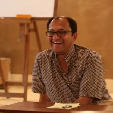 Portrait of a smiling man in a checked shirt