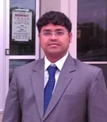 Portrait of Dharmendra Jena in formal attire