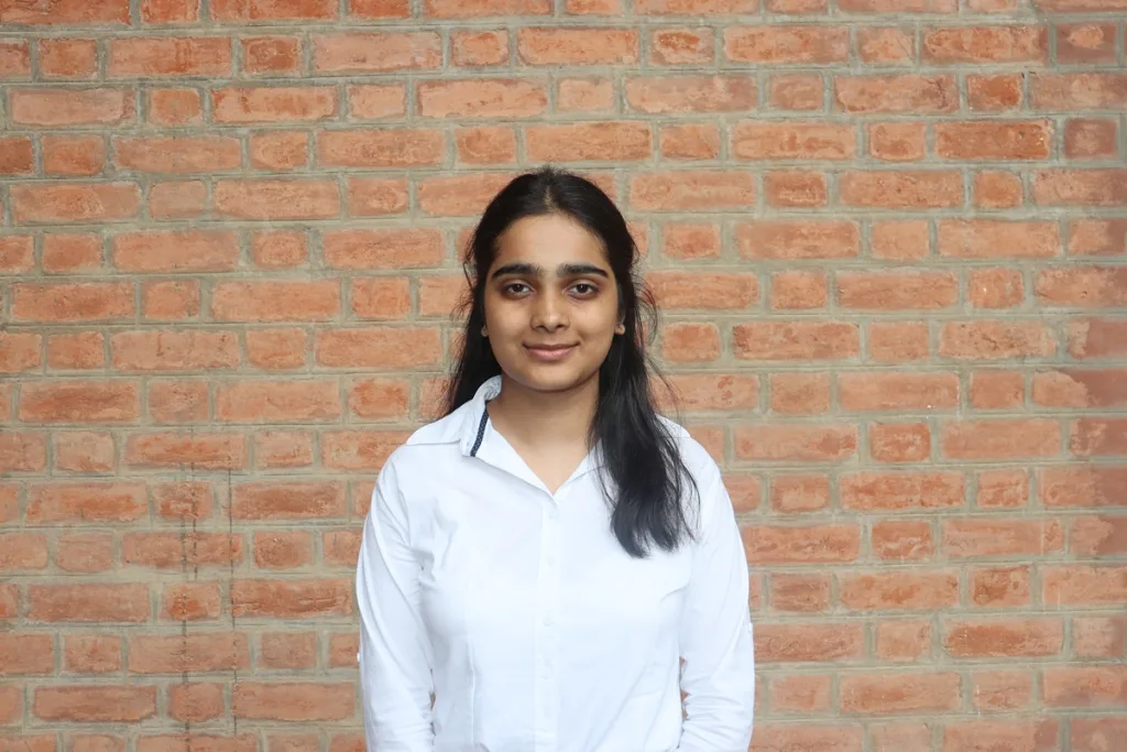 Portrait of a woman student in formal attire
