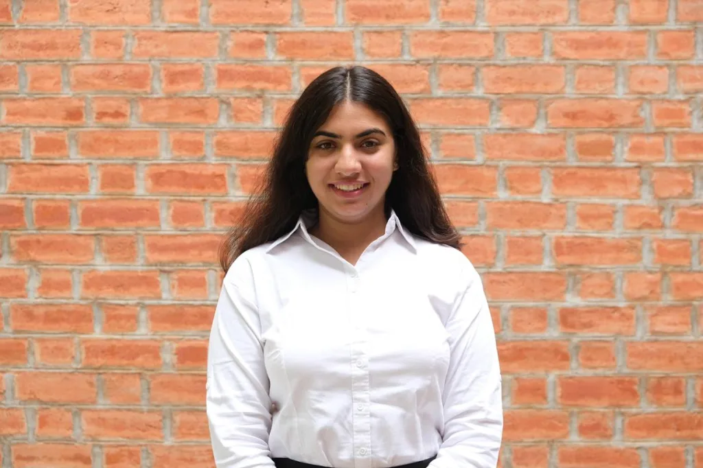 Portrait of a woman student in formal attire