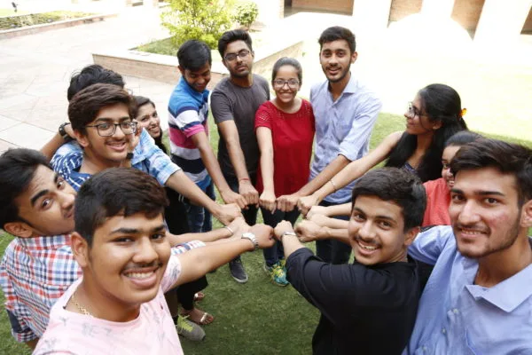 Group of students posing together cheerfully